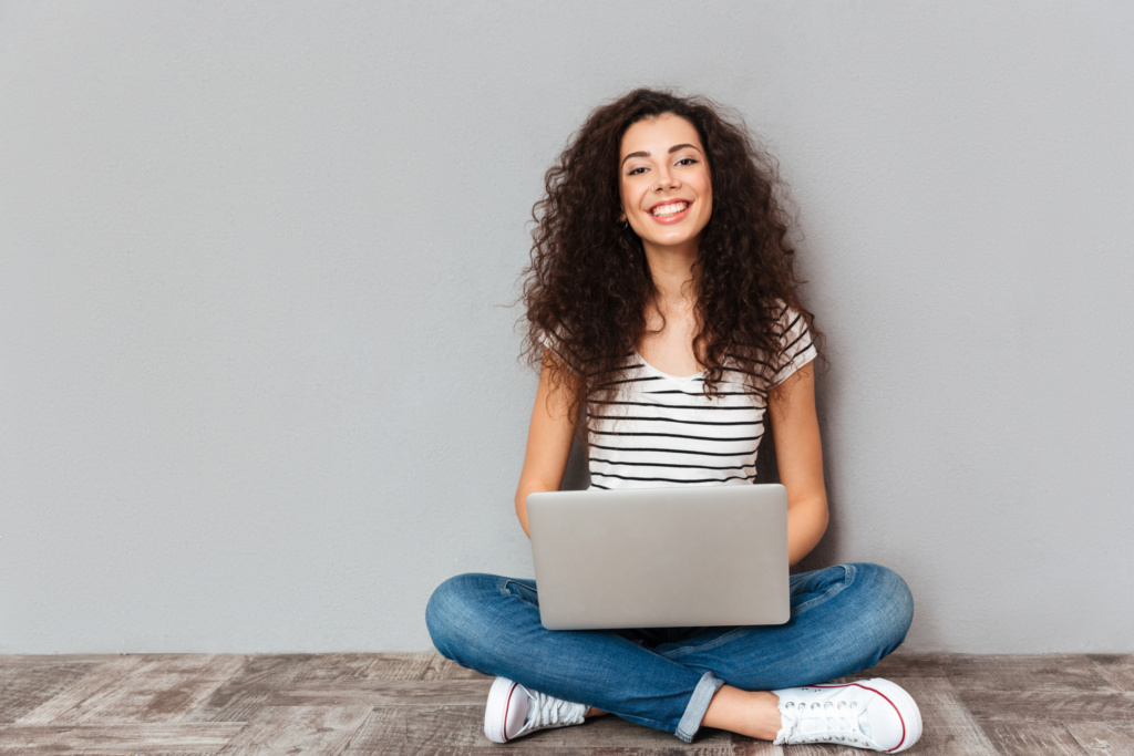 Portrait,of,satisfied,female,with,beautiful,smile,enjoying,watching,movie