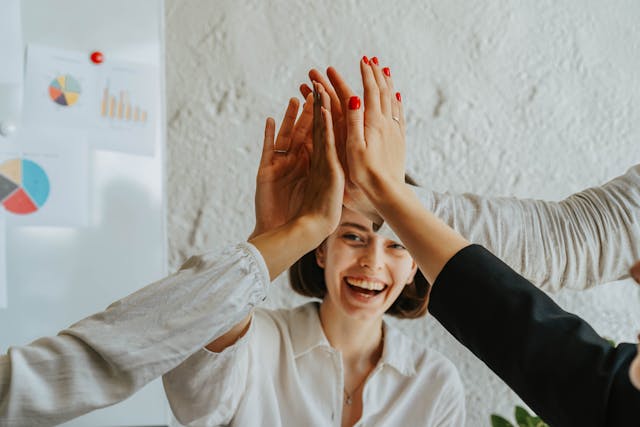 Happy Woman High Five Career Development Goals