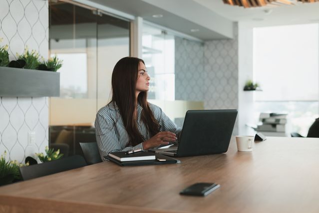 Woman At Desk With Laptop Cpd